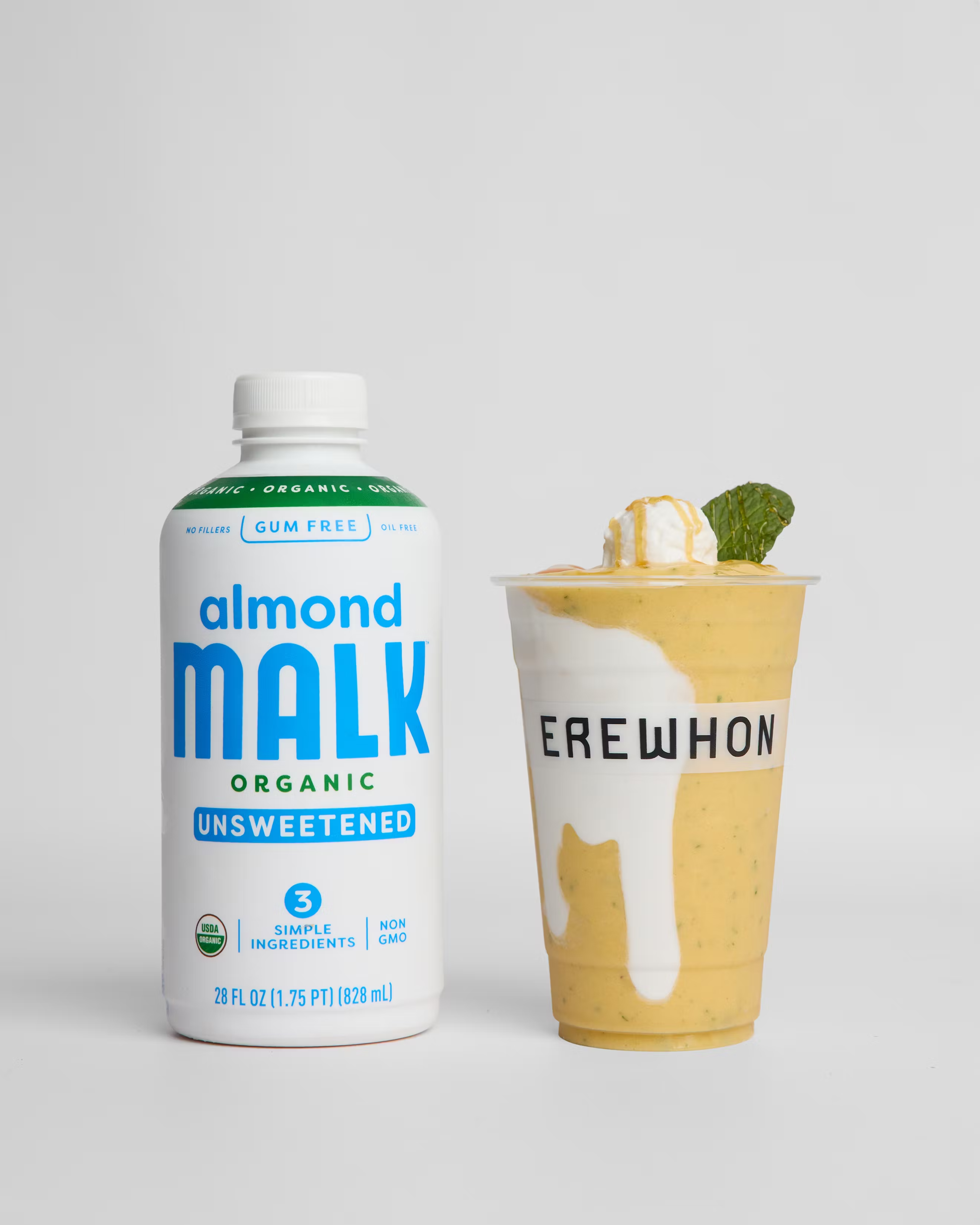 A bottle of Almond MALK next to a golden smoothie created by celebrity chef Nara Smith