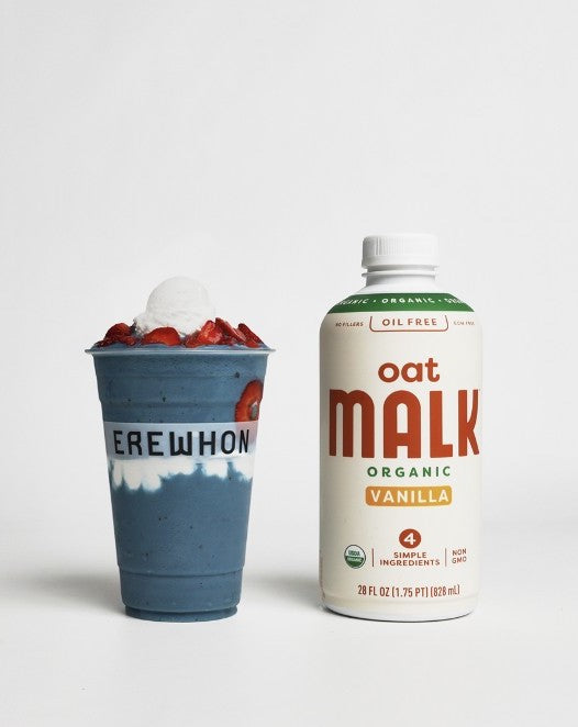Bottle of Oat MALK next to a red, white and blue smoothie