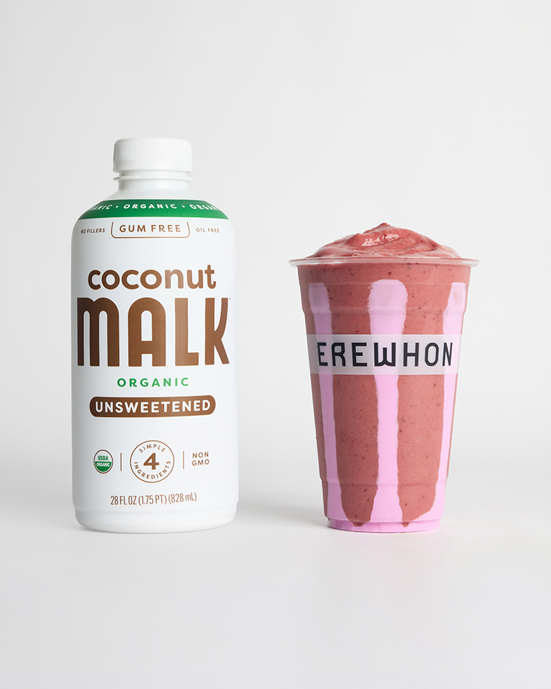 MALK Organics Unsweetened Coconut Milk bottle next to the Katseye x Erewhon Gabriela Smoothie