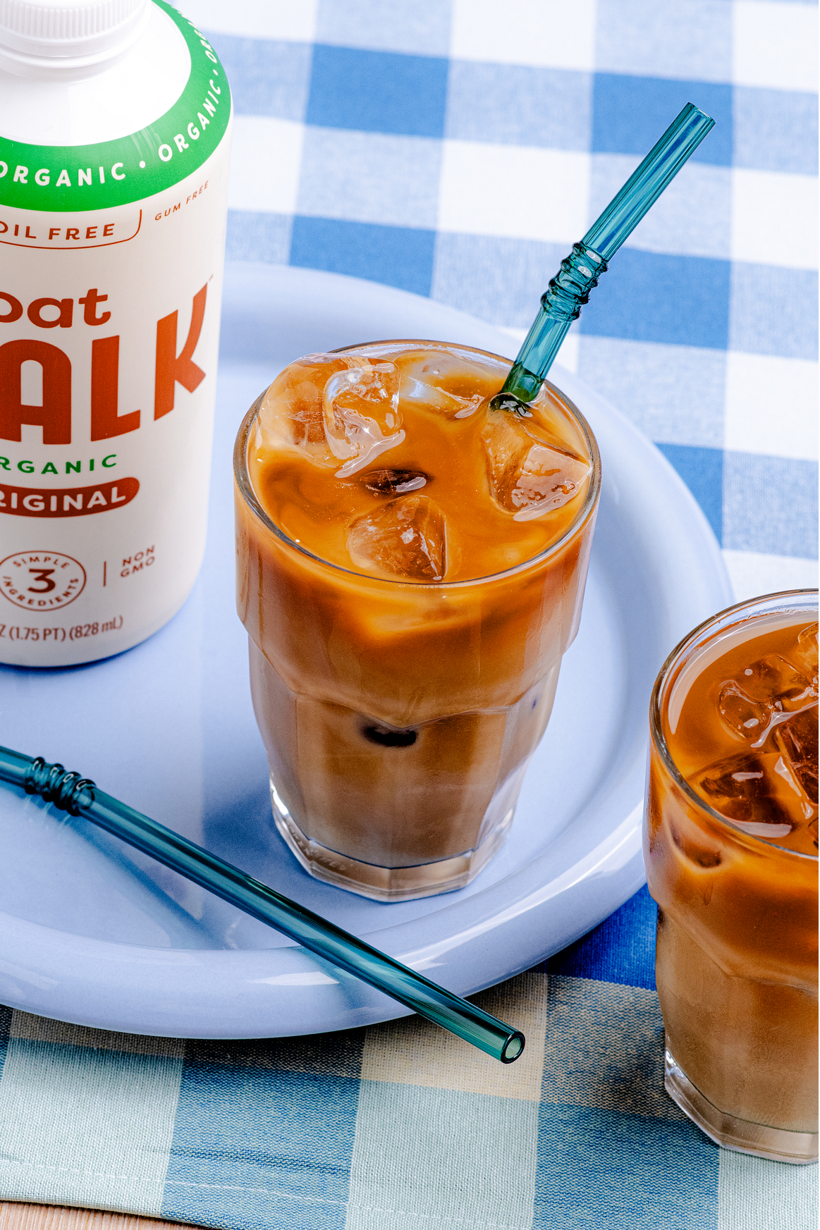 Brown sugar shaken espresso made with MALK Original Oat Milk, layered over ice and topped with creamy MALK Unsweetened Creamer