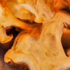 MALK Vanilla Coconut Milk Creamer being poured into iced coffee